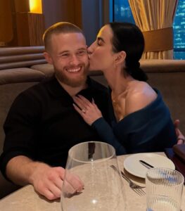 ## Fitness Influencer and Researcher Dr. Stephanie Buttermore Dies at 35 The fitness and science community is mourning the sudden passing of Dr. Stephanie Buttermore, a respected fitness influencer, researcher, and advocate for evidence-based health education. She was 35 years old. News of her death was shared publicly by her fiancé, Jeff Nippard, in a heartfelt statement posted on social media. Dr. Buttermore had built a large and dedicated following online through her commitment to science-backed fitness and nutrition information. Known for blending academic knowledge with practical guidance, she helped thousands of people better understand training, diet, and overall wellness. Her content often broke down complex research into easy-to-understand explanations, making evidence-based health education more accessible to the public. Beyond her work as a fitness influencer, Dr. Buttermore was also an accomplished academic. She held a PhD and conducted research focused on ovarian cancer, contributing to important scientific efforts aimed at better understanding the disease and improving long-term outcomes for patients. Her ability to combine rigorous research with public education made her a respected voice in both the scientific and fitness communities. Through her videos, social media posts, and collaborations, Dr. Buttermore became widely recognized not only for her knowledge but also for her honesty and openness about personal health challenges. Many followers admired her willingness to discuss topics such as body image, metabolism, and sustainable nutrition. Her approach encouraged healthier relationships with food and exercise, emphasizing balance rather than extremes. According to the statement shared by Jeff Nippard, her passing was sudden. At this time, a cause of death has not been publicly disclosed. The announcement quickly prompted an outpouring of condolences from fans, fellow fitness professionals, and researchers who had followed her work or collaborated with her over the years. Tributes continue to flood social media, with many remembering Dr. Stephanie Buttermore as a passionate educator, dedicated researcher, and compassionate individual who worked tirelessly to share knowledge that could improve people’s lives. Her influence on the fitness and science communities will not be forgotten, and her legacy will continue through the many lives she inspired. 